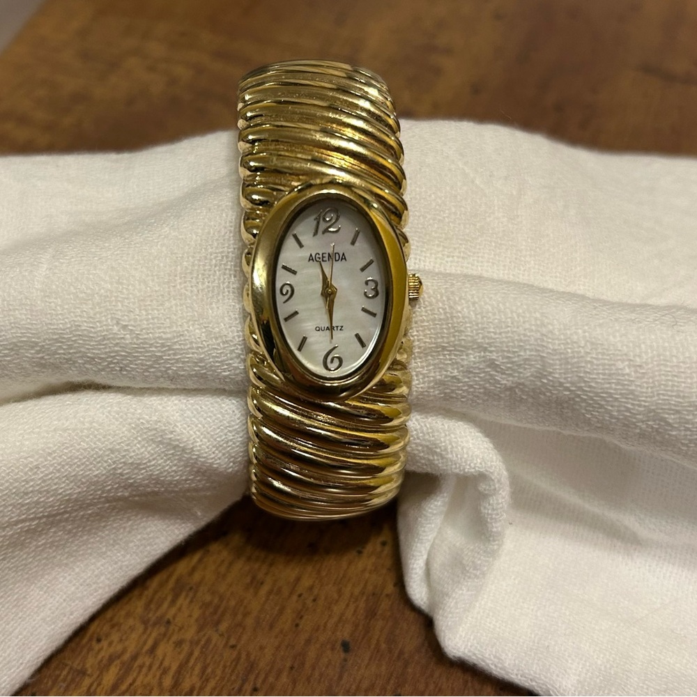women's gold-tone bangle watch by the brand Vivani